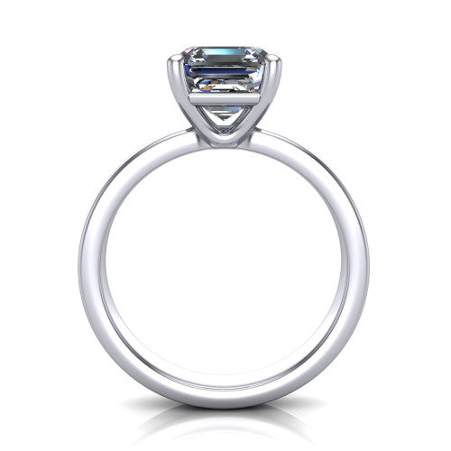 Louise square emerald classic solitaire engagement ring in Platinum, through-finger front profile showing the square emerald center raised above the wide flat band