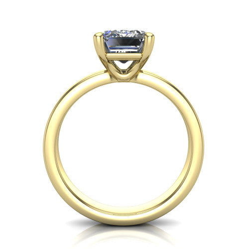 Louise emerald classic solitaire engagement ring in 14K Yellow Gold, through-finger front profile showing the emerald center raised above the wide flat band
