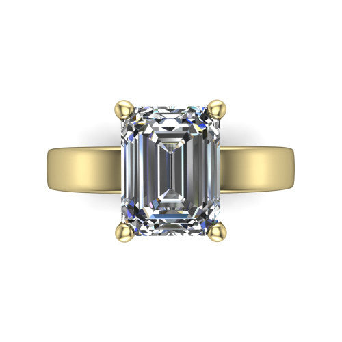 Louise emerald classic solitaire engagement ring in 14K Yellow Gold, top-down view showing the four-prong emerald solitaire center and the wide band