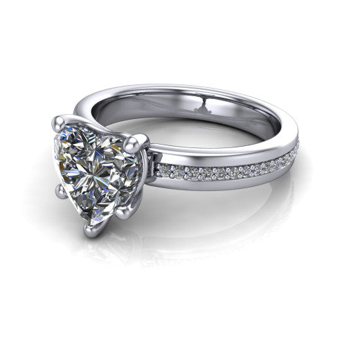 Kamala heart classic solitaire engagement ring in Platinum, three-quarter perspective showing the heart center on claw prongs above a wide channel-set pav&eacute; band
