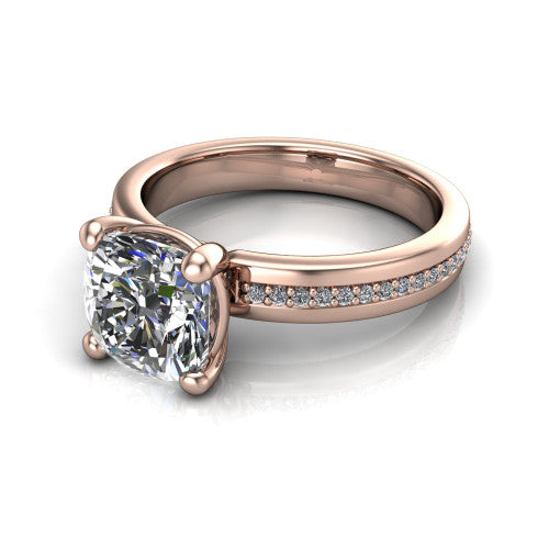 Kamala cushion classic solitaire engagement ring in 18K Rose Gold, three-quarter perspective showing the cushion center on claw prongs above a wide channel-set pav&eacute; band