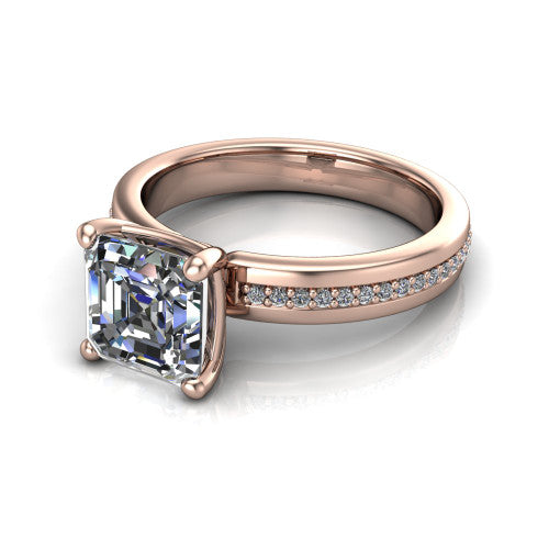 Kamala square emerald classic solitaire engagement ring in 14K Rose Gold, three-quarter perspective showing the square emerald center on claw prongs above a wide channel-set pav&eacute; band