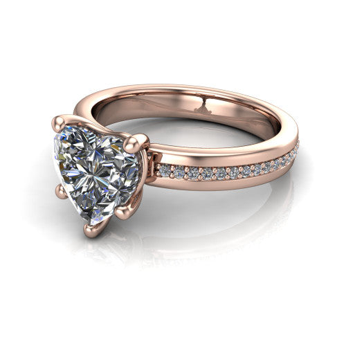 Kamala heart classic solitaire engagement ring in 14K Rose Gold, three-quarter perspective showing the heart center on claw prongs above a wide channel-set pav&eacute; band