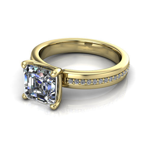 Kamala square emerald classic solitaire engagement ring in 14K Yellow Gold, three-quarter perspective showing the square emerald center on claw prongs above a wide channel-set pav&eacute; band