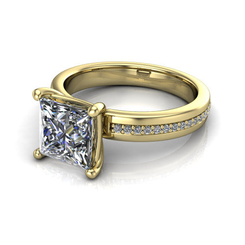 Kamala princess classic solitaire engagement ring in 14K Yellow Gold, three-quarter perspective showing the princess center on claw prongs above a wide channel-set pav&eacute; band