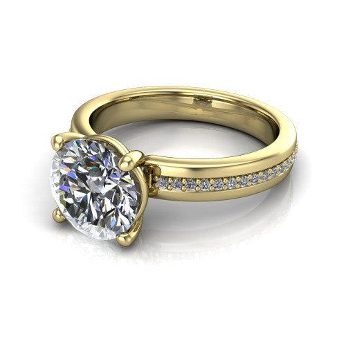 Kamala round classic solitaire engagement ring in 18K Yellow Gold, three-quarter perspective showing the round center on claw prongs above a wide channel-set pav&eacute; band