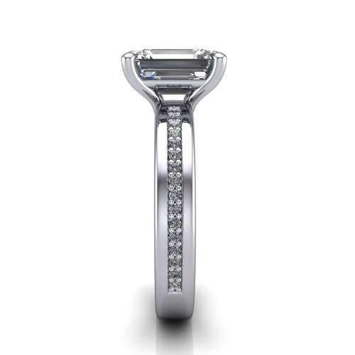 Kamala emerald classic solitaire engagement ring in Platinum, side profile showing the wide channel-set pav&eacute; band with high-polish edges and the open basket