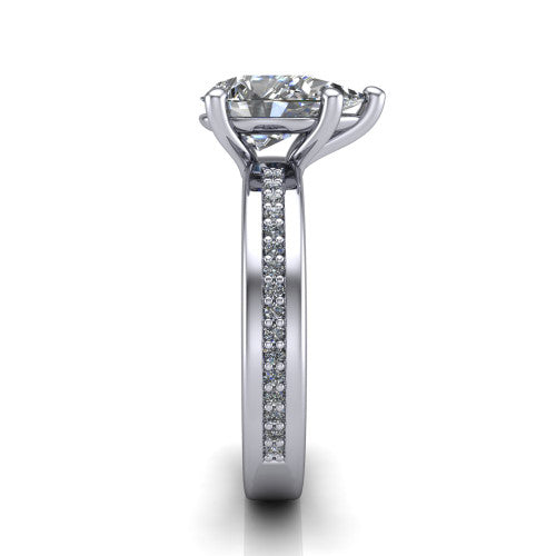 Kamala pear classic solitaire engagement ring in 14K White Gold, side profile showing the wide channel-set pav&eacute; band with high-polish edges and the open basket