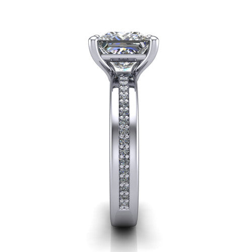 Kamala princess classic solitaire engagement ring in Platinum, side profile showing the wide channel-set pav&eacute; band with high-polish edges and the open basket