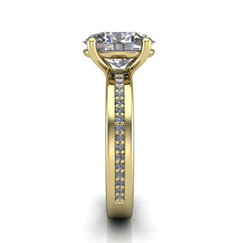 Kamala oval classic solitaire engagement ring in 14K Yellow Gold, side profile showing the wide channel-set pav&eacute; band with high-polish edges and the open basket