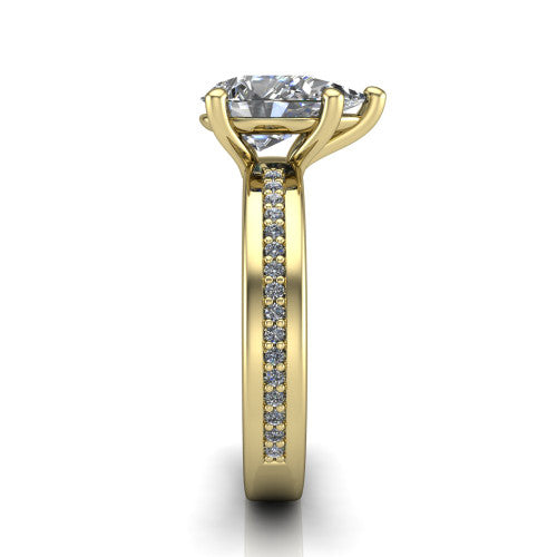 Kamala pear classic solitaire engagement ring in 18K Yellow Gold, side profile showing the wide channel-set pav&eacute; band with high-polish edges and the open basket