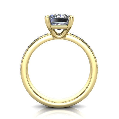 Kamala emerald classic solitaire engagement ring in 14K Yellow Gold, through-finger front profile showing the emerald center raised above the channel-set band