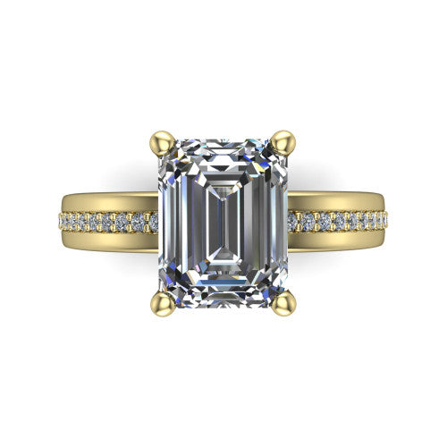 Kamala emerald classic solitaire engagement ring in 14K Yellow Gold, top-down view showing the four-prong emerald center and the channel row of diamonds down the band
