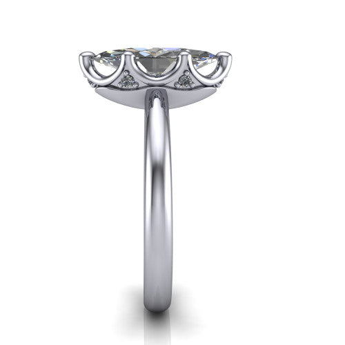 Josie marquise east-west solitaire engagement ring in Platinum with plain band, side profile showing the plain band and bezel-set under-gallery accent