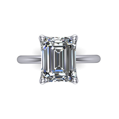 Josie emerald east-west solitaire engagement ring in 18K White Gold with plain band, top-down view of the east-west four-prong head