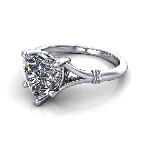 Luna heart classic solitaire engagement ring in 18K White Gold, three-quarter perspective showing the heart center on claw prongs above a plain split shank with pav&eacute; accent collars