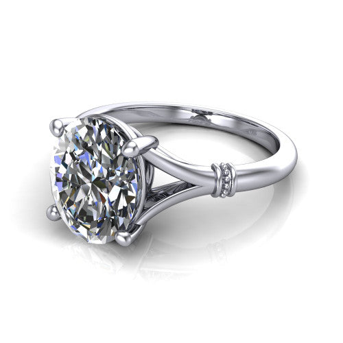 Luna oval classic solitaire engagement ring in 14K White Gold, three-quarter perspective showing the oval center on claw prongs above a plain split shank with pav&eacute; accent collars