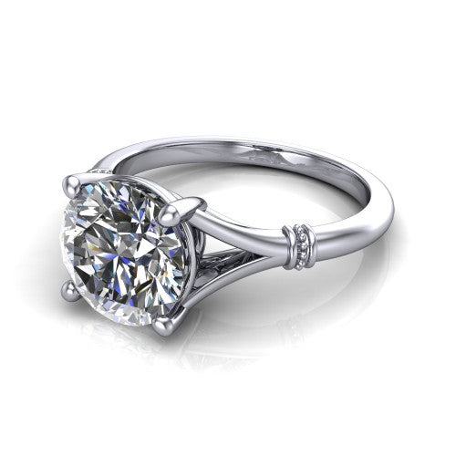 Luna round classic solitaire engagement ring in 14K White Gold, three-quarter perspective showing the round center on claw prongs above a plain split shank with pav&eacute; accent collars
