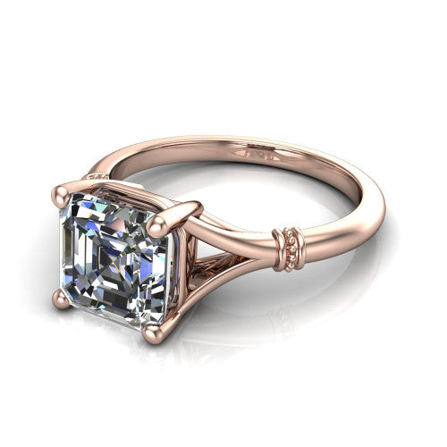 Luna square emerald classic solitaire engagement ring in 14K Rose Gold, three-quarter perspective showing the square emerald center on claw prongs above a plain split shank with pav&eacute; accent collars