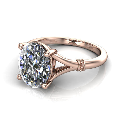 Luna oval classic solitaire engagement ring in 14K Rose Gold, three-quarter perspective showing the oval center on claw prongs above a plain split shank with pav&eacute; accent collars