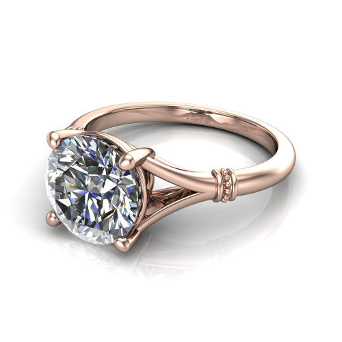 Luna round classic solitaire engagement ring in 18K Rose Gold, three-quarter perspective showing the round center on claw prongs above a plain split shank with pav&eacute; accent collars