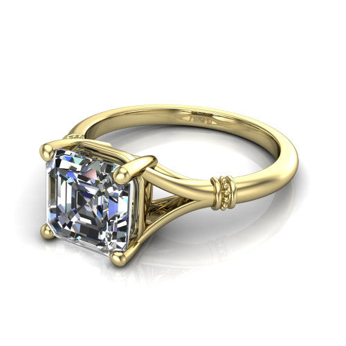 Luna square emerald classic solitaire engagement ring in 18K Yellow Gold, three-quarter perspective showing the square emerald center on claw prongs above a plain split shank with pav&eacute; accent collars