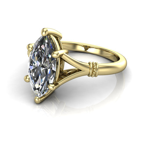Luna marquise classic solitaire engagement ring in 18K Yellow Gold, three-quarter perspective showing the marquise center on claw prongs above a plain split shank with pav&eacute; accent collars