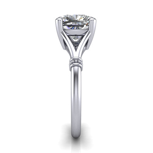 Luna cushion classic solitaire engagement ring in Platinum, side profile showing the plain split shank with pav&eacute; accent collars rising to the cushion center