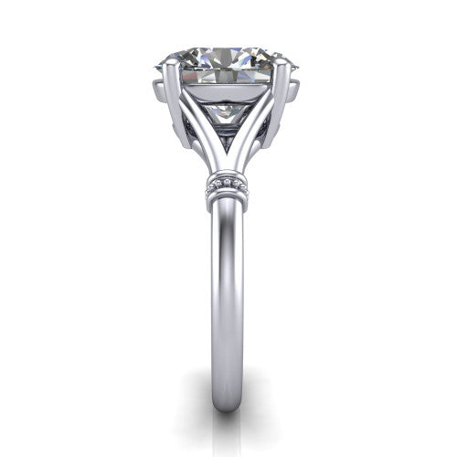 Luna oval classic solitaire engagement ring in Platinum, side profile showing the plain split shank with pav&eacute; accent collars rising to the oval center