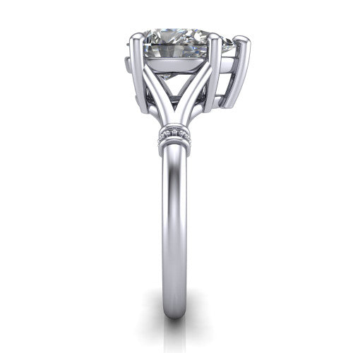 Luna pear classic solitaire engagement ring in Platinum, side profile showing the plain split shank with pav&eacute; accent collars rising to the pear center