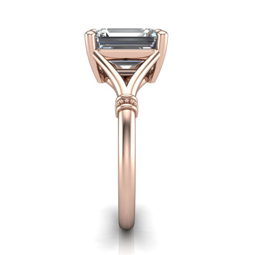 Luna emerald classic solitaire engagement ring in 18K Rose Gold, side profile showing the plain split shank with pav&eacute; accent collars rising to the emerald center