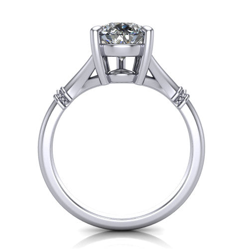 Luna pear classic solitaire engagement ring in Platinum, through-finger front profile showing the pear center raised above the plain split shank
