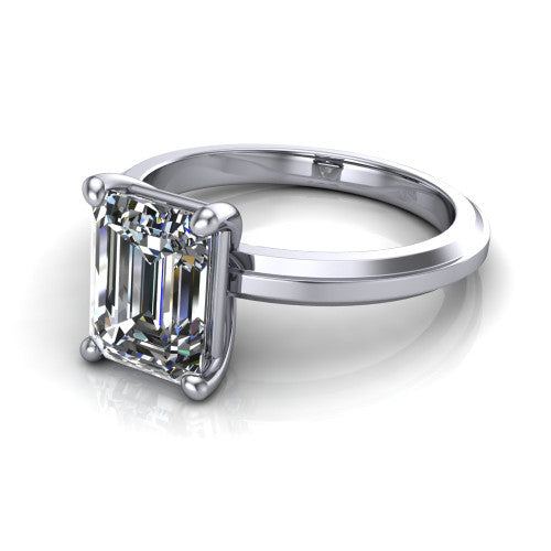 Ellie emerald classic solitaire engagement ring in 14K White Gold, three-quarter perspective showing the emerald center on claw prongs above a wide flat knife-edge band