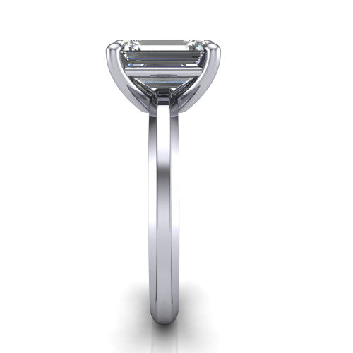 Ellie emerald classic solitaire engagement ring in 18K White Gold, side profile showing the substantial knife-edge band and the open basket beneath the emerald center