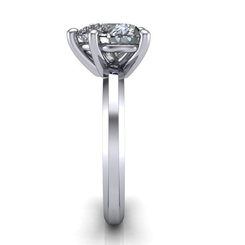 Ellie heart classic solitaire engagement ring in Platinum, side profile showing the substantial knife-edge band and the open basket beneath the heart center