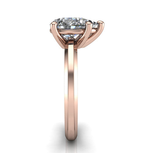 Ellie pear classic solitaire engagement ring in 18K Rose Gold, side profile showing the substantial knife-edge band and the open basket beneath the pear center