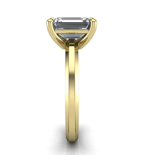 Ellie emerald classic solitaire engagement ring in 14K Yellow Gold, side profile showing the substantial knife-edge band and the open basket beneath the emerald center