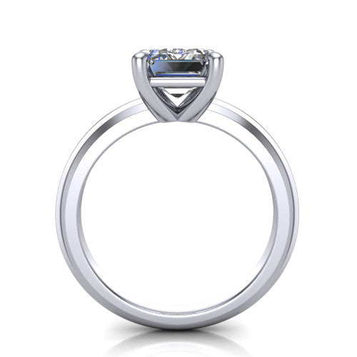 Ellie emerald classic solitaire engagement ring in 18K White Gold, through-finger front profile showing the emerald center raised above the wide knife-edge band