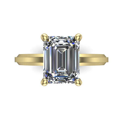 Ellie emerald classic solitaire engagement ring in 14K Yellow Gold, top-down view showing the four-prong emerald solitaire center and the wide band