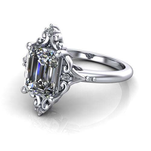 Hazel emerald vintage filigree engagement ring in 14K White Gold, three-quarter perspective showing the emerald center in an ornate filigree scroll frame above a plain band