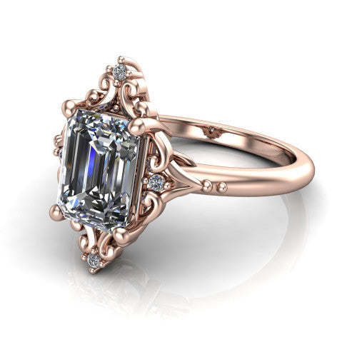 Hazel emerald vintage filigree engagement ring in 18K Rose Gold, three-quarter perspective showing the emerald center in an ornate filigree scroll frame above a plain band