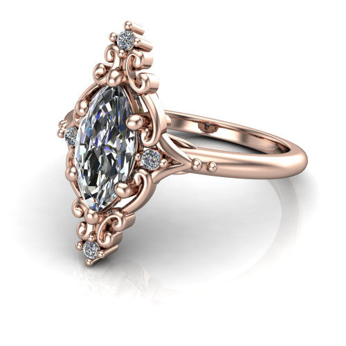 Hazel marquise vintage filigree engagement ring in 18K Rose Gold, three-quarter perspective showing the marquise center in an ornate filigree scroll frame above a plain band