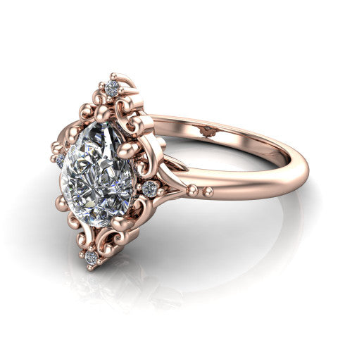 Hazel pear vintage filigree engagement ring in 14K Rose Gold, three-quarter perspective showing the pear center in an ornate filigree scroll frame above a plain band