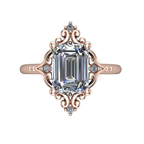 Hazel emerald vintage filigree engagement ring in 18K Rose Gold, top-down view showing the vintage scrollwork frame and corner diamond accents around the emerald center