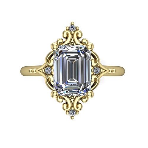 Hazel emerald vintage filigree engagement ring in 18K Yellow Gold, top-down view showing the vintage scrollwork frame and corner diamond accents around the emerald center