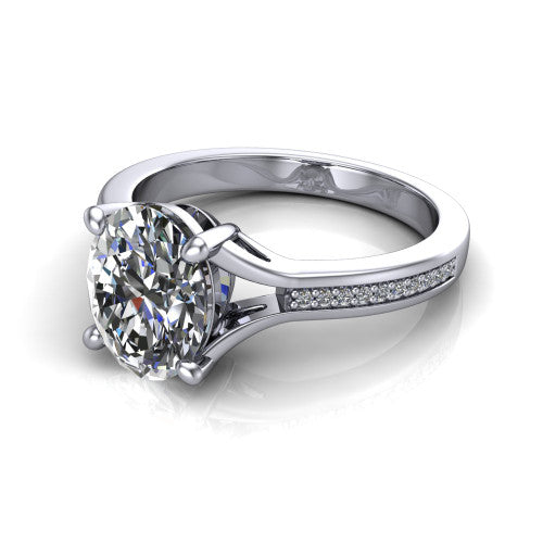 Isla oval classic solitaire engagement ring in 14K White Gold, three-quarter perspective showing the oval center on claw prongs above a channel-set pav&eacute; split shank