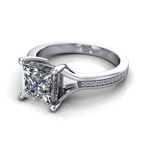 Isla princess classic solitaire engagement ring in 18K White Gold, three-quarter perspective showing the princess center on claw prongs above a channel-set pav&eacute; split shank