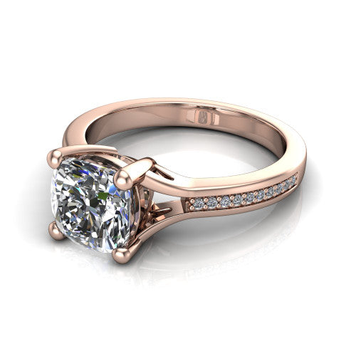 Isla cushion classic solitaire engagement ring in 14K Rose Gold, three-quarter perspective showing the cushion center on claw prongs above a channel-set pav&eacute; split shank