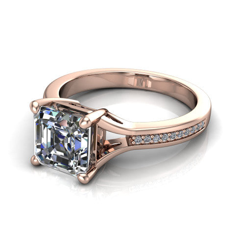 Isla square emerald classic solitaire engagement ring in 18K Rose Gold, three-quarter perspective showing the square emerald center on claw prongs above a channel-set pav&eacute; split shank