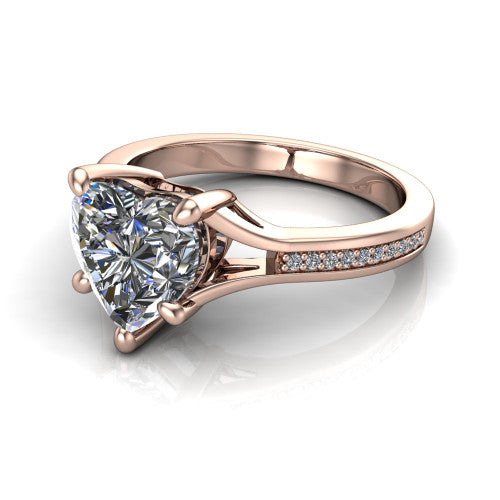 Isla heart classic solitaire engagement ring in 14K Rose Gold, three-quarter perspective showing the heart center on claw prongs above a channel-set pav&eacute; split shank